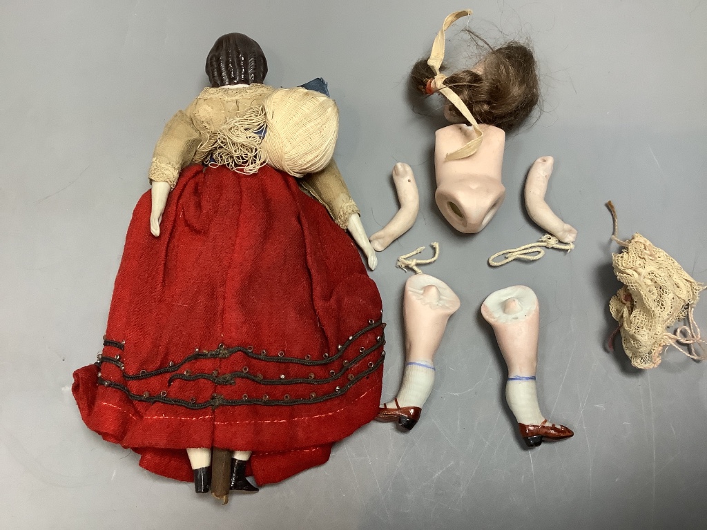 A Parian head soft body bisque hands and flat boots, original costume, height 20cm, small bisque doll